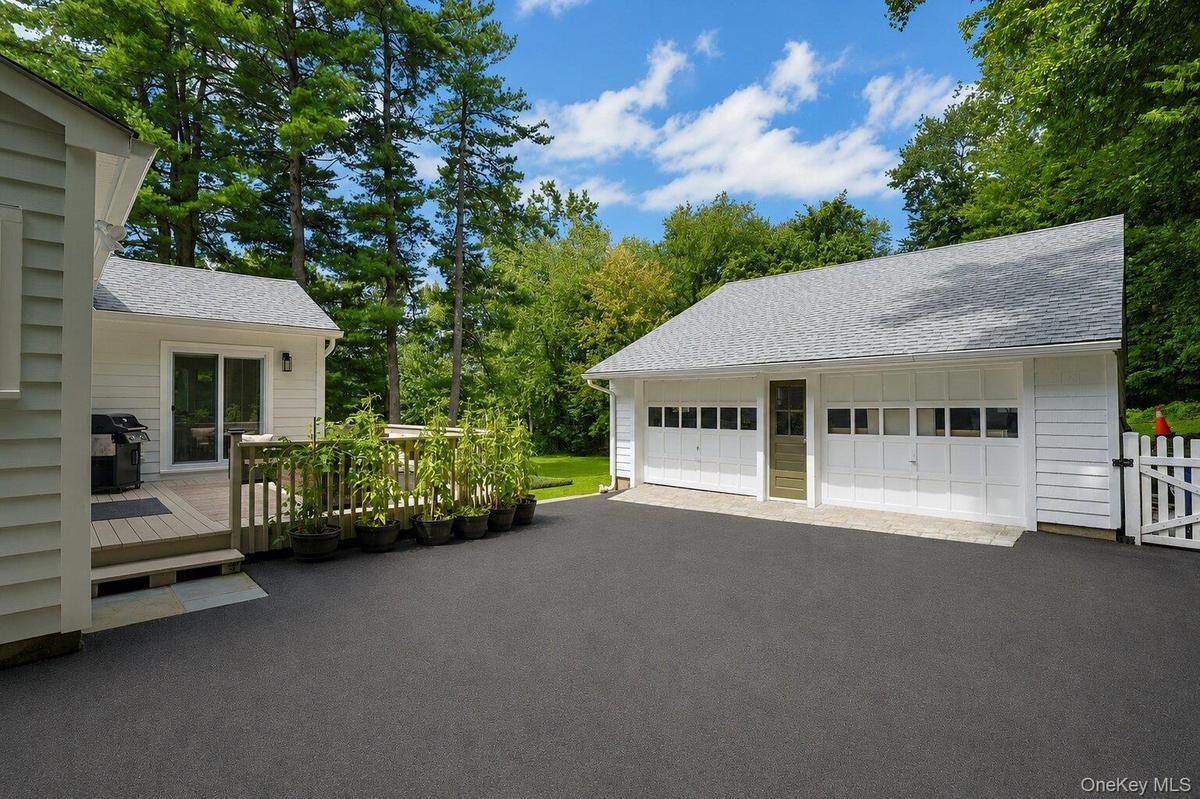 View of the deck and this large driveway!