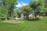 Beautiful, level lawn offering plenty of space for outdoor fun, playtime, and children's playground, the perfect level yard!