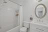 Well appointed full bathroom featuring a relaxing tub/shower