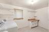 Spacious Laundry Room With New Washer and Dryer