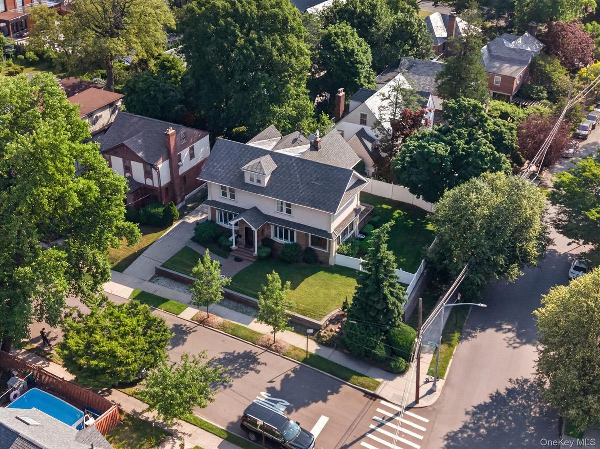 Two-story residence featuring a gabled roof and covered front porch