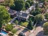 Two-story residence featuring a gabled roof and covered front porch