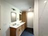 Double sink vanity and recessed lighting in Bathroom