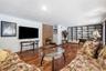 Spacious Family Room With Fireplace and Built In Bookcase