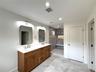 Double sink vanity and stall shower