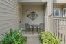Past the driveway, with two parking spaces and private garage, open the gate to the fenced in and beautifully planted main entrance. You could pause f