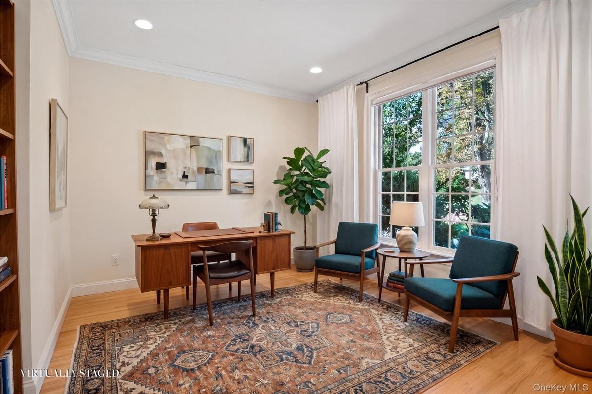 Virtually staged room. first floor Library is perfect as a first floor bedroom. There is a full bath on the same level.