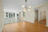 Natural wood floors, Large windows, natural light.