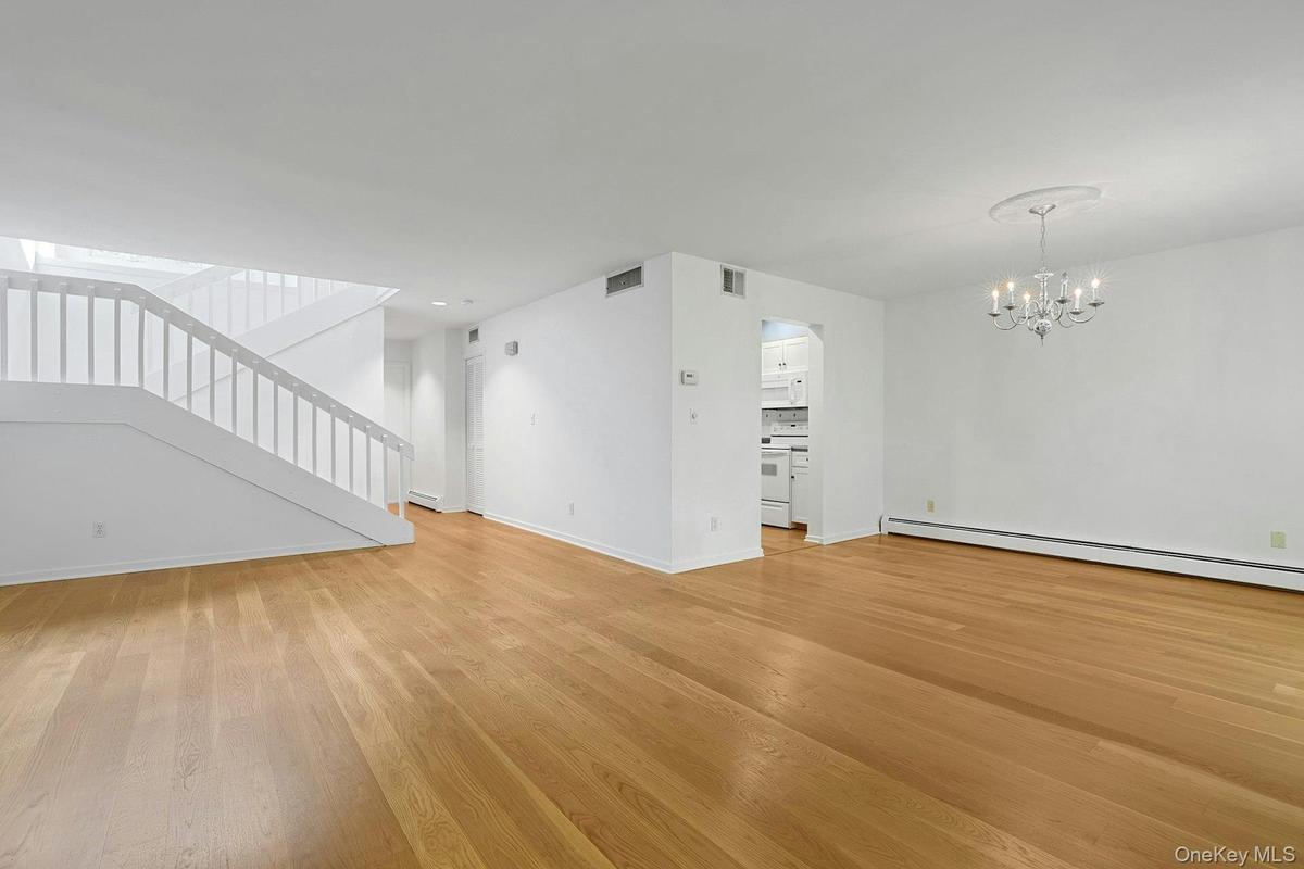 The living room and dining room flow together, making entertaining and meal time so much easier and pleasant. The kitchen is also easily accessible of