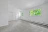The primary bedroom retreat is large and deep, running the whole width of the home. High ceilings here as well bring a sense of peace.