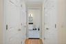 Walk in closets to the right and left as you walk toward the primary bathroom