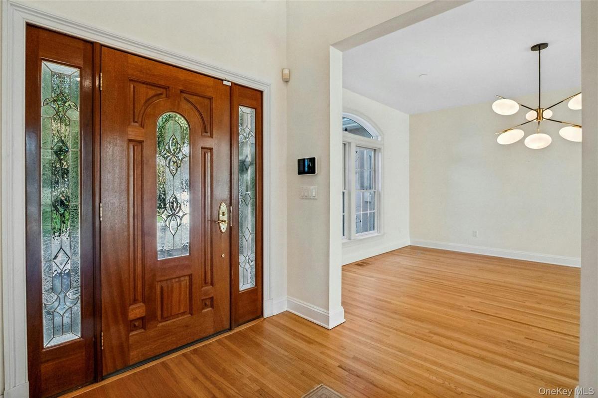 High ceilings and expansive windows fill the space with natural light.