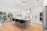 The chef is in the middle of the activity with the open kitchen, dining and family room.