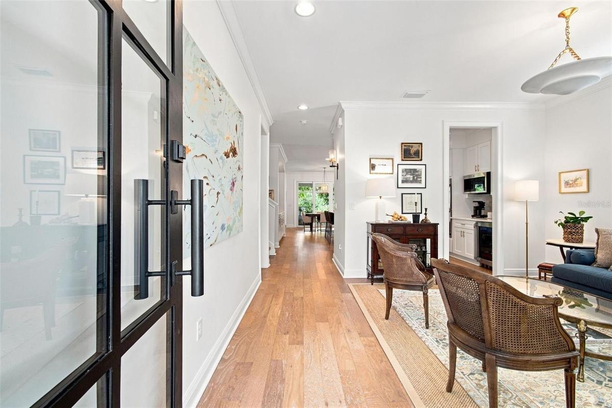 Custom glass front door provides a light filled entry.