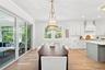 Dining area opens onto screen porch.