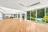 Open floor concept. Living room and dining room with view ceiling to floor sliding doors leading to backyard.