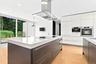 Built-in coffee machine and TV.