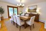 Photo Visually Staged.  Photo Visually Staged.  The Dining Room has hardwood floors, opens to both the Kitchen and Living room and has sliding glass d
