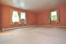 Large Primary Bedroom has wall to wall carpeting, two large closet and a private bath.  The room is approx. 16'-6" x 16'-2".
