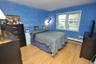 Second Bedroom has hardwood floors and is approx. 12'-11" x 10'-11".