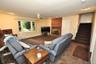Lower Level recreation room has a fireplace, access to the outside, garage and utility room and storage.  The room is approx. 19'-4" x 18'-6".