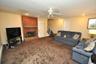 Lower Level recreation room has a fireplace, access to the outside, garage and utility room and storage.  The room is approx. 19'-4" x 18'-6".