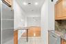 Stainless steel refrigerator and dishwasher with granite countertops