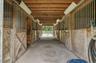 beams, overhead lighting, and a concrete pathway
