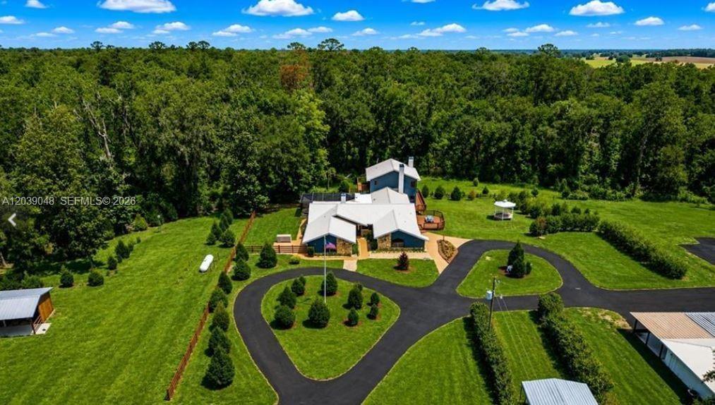 Aerial perspective showcasing the extraordinary scale of the estate's commercial and storage facilities, including multiple high-capacity structures d