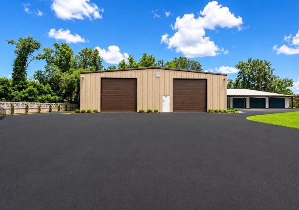 Oversized detached garage structure offering substantial capacity for vehicles, equipment, or workshop use. Ideal for collectors, contractors, or stor