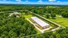 Natural Florida landscape surrounding the property with abundant space and long-term development potential.