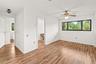 Comfortable guest bedroom offering a peaceful retreat with a functional layout and natural light.