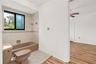 Comfortable guest bedroom offering a peaceful retreat with a functional layout and natural light.