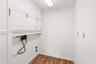 Well-placed utility room offering ease of access and a functional setup for daily living needs.