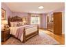 Hardwood flooring, recessed lighting, and a window with blinds and drapes