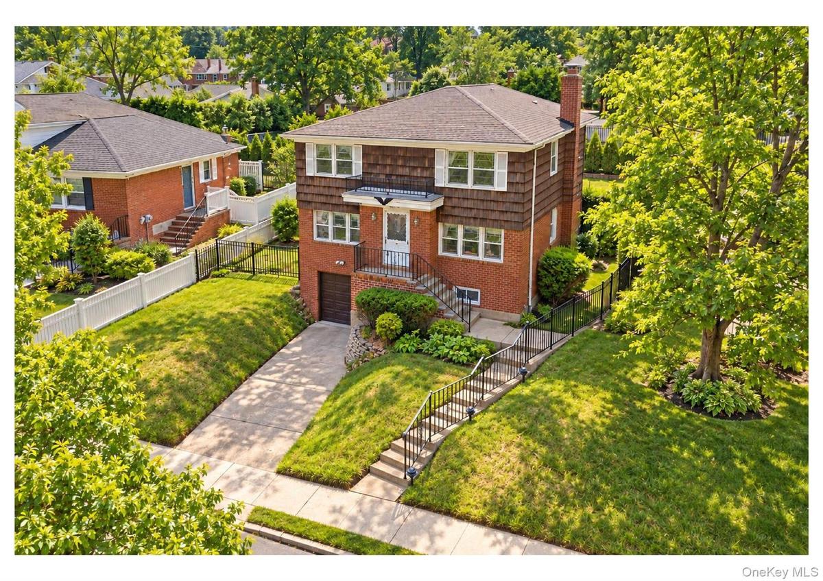 Brick and shingle exterior with a gabled roof