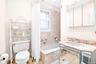 Full bathroom with a sink and a combined bath / shower with marble appearance