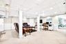 Office area featuring a wainscoted wall, a paneled ceiling, and light tile patterned floors