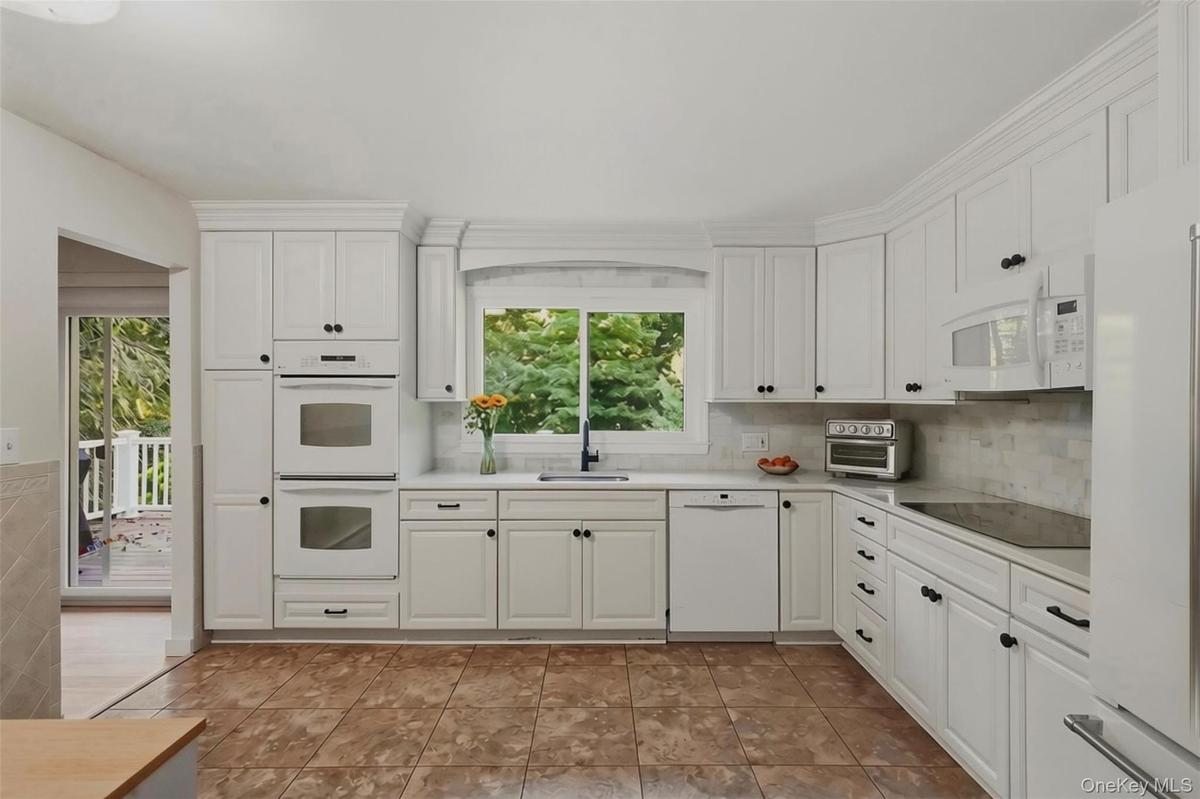 Kitchen with access to sliding doors to porch