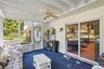 Sunroom with access to den and pool