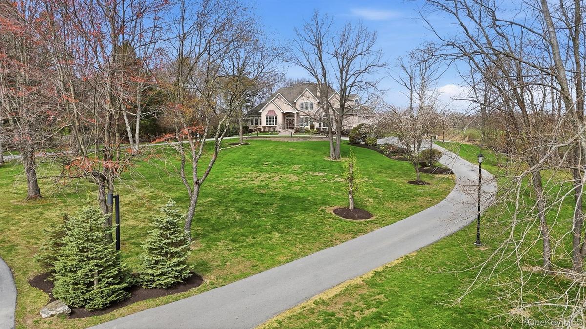 The property is at the end of a cul-de-sac with a long driveway, great landscaping for maximum privacy.