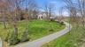 The property is at the end of a cul-de-sac with a long driveway, great landscaping for maximum privacy.