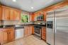 Updated eat in kitchen accented with stainless steel appliances.