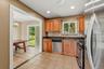 The kitchen is accented with tile flooring and granite countertops.