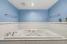 Large bathroom on lower lever with large tub.