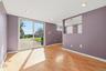 Large recreation room on lower level with sliding glass door to the front of the home.