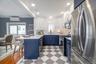 Newly renovated kitchen with stainless steel appliances and gas cooking.