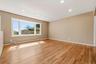 Gleaming, newly refinished hardwood flooring accents the main level.