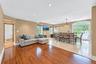 Hardwood flooring, recessed lighting, and a dining area with tile flooring