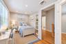 bonus room ideas Recessed lighting illuminates this room featuring wood-finish flooring